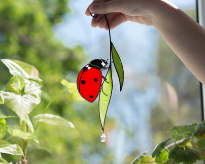 Stained glass Ladybug on the leaves suncatcher